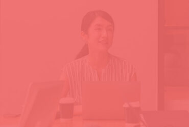 Professional woman smiling at meeting