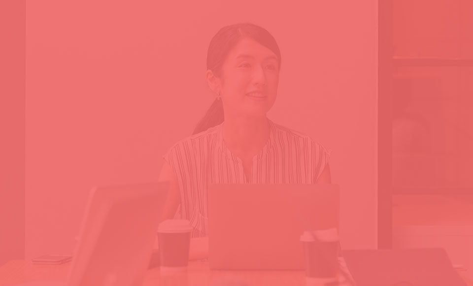Professional woman smiling at meeting